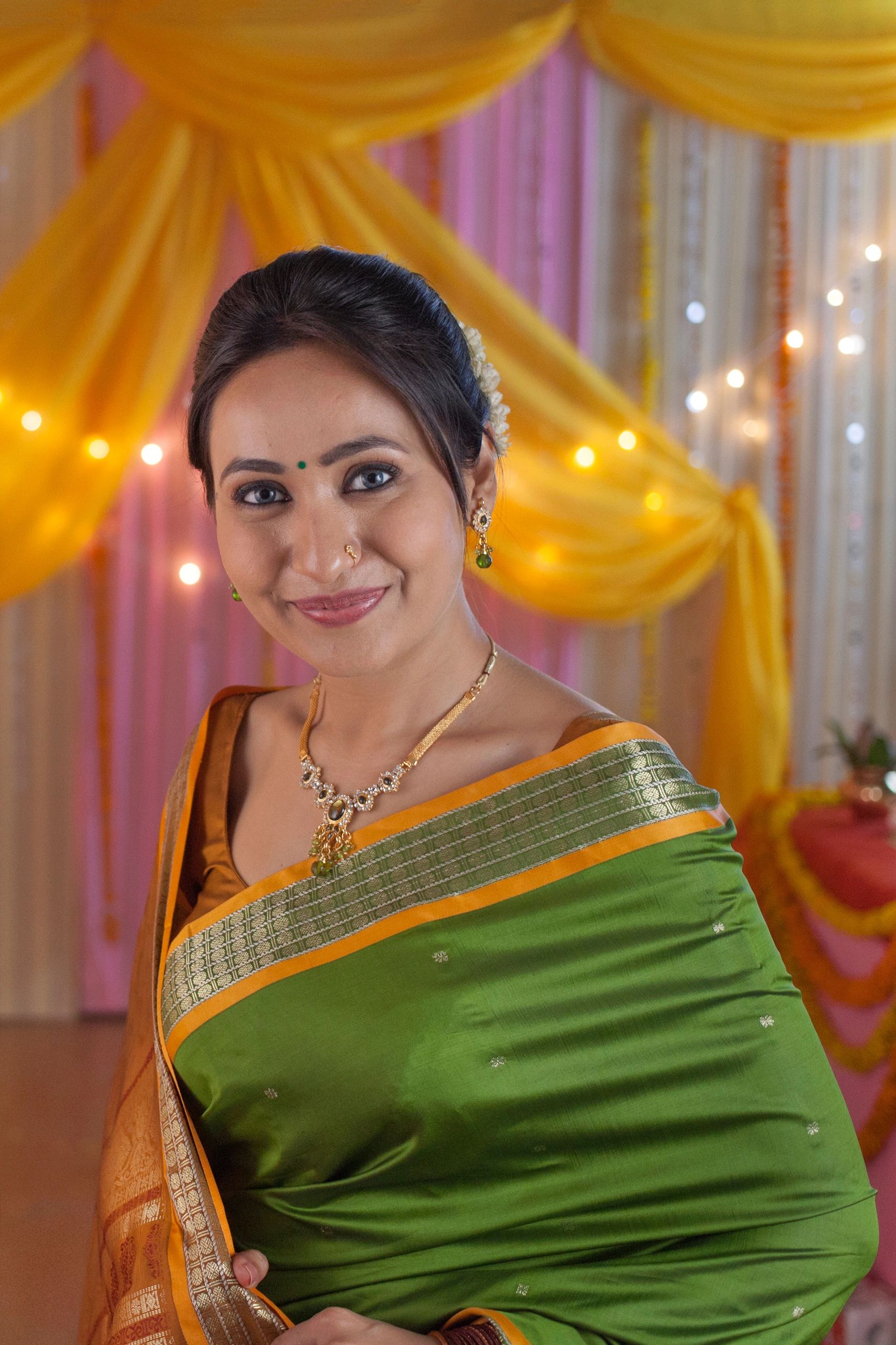 Woman in a traditional saree at a festive celebration